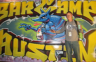 A portrait of the artist and his work -- Cody, the guy who did the Bar Camp mural.